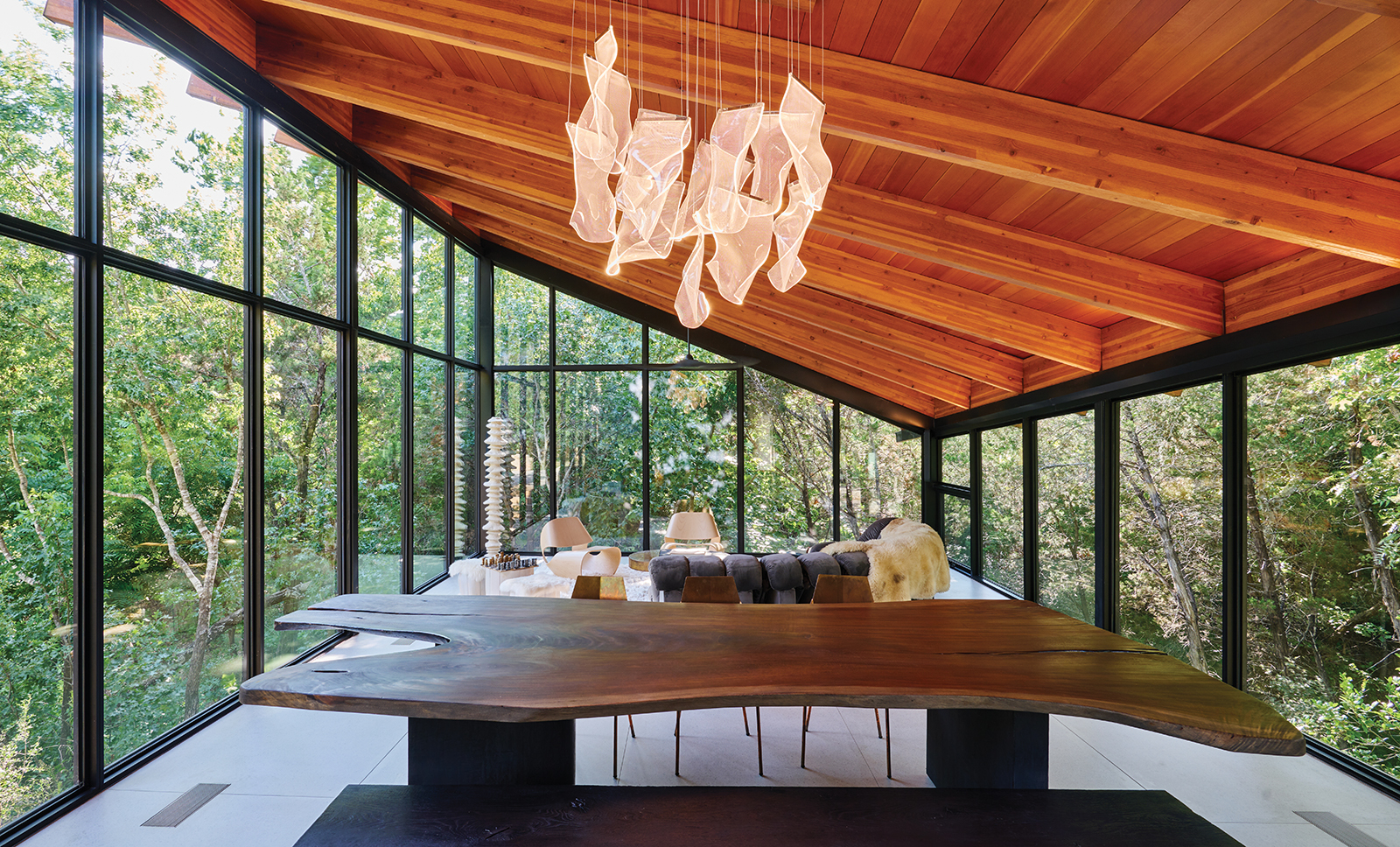 This House's Sweeping Roofs Engage the Surrounding Wilderness